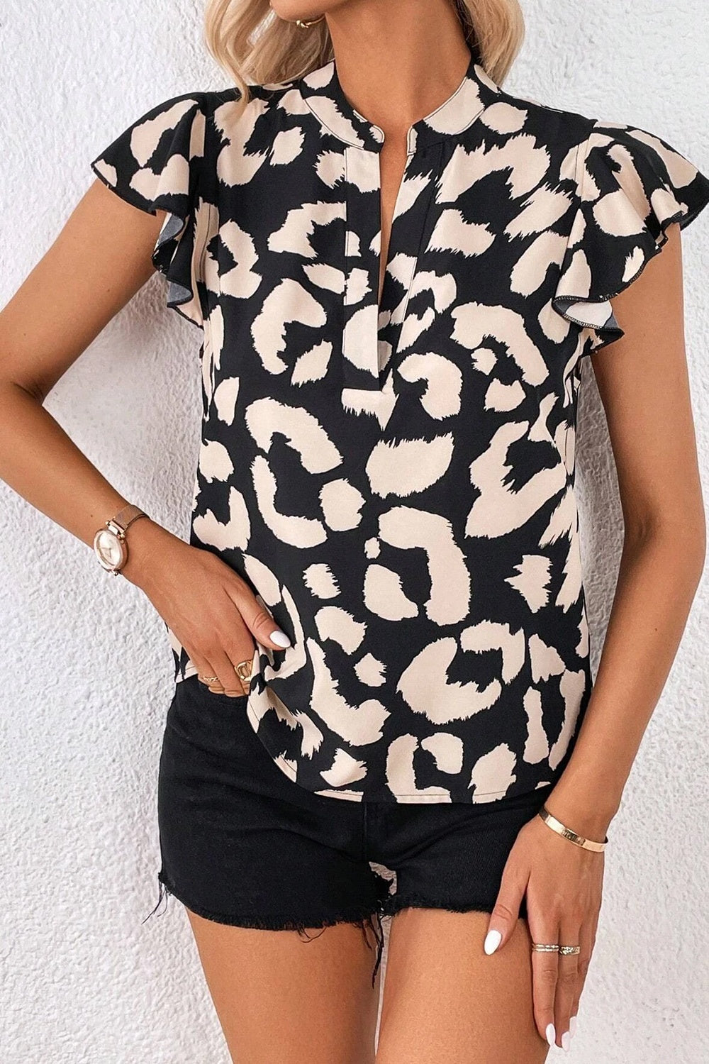 Leopard Notched Cap Sleeve Blouse - House of Binx