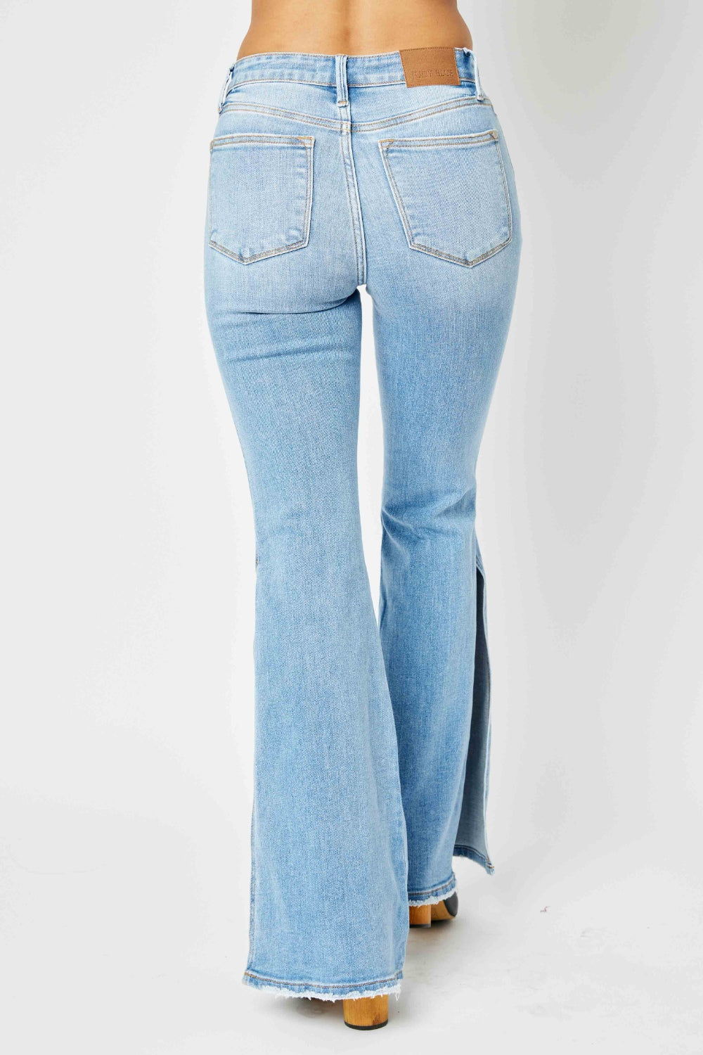 Judy Blue Full Size Mid Rise Raw Hem Slit Flare Jeans - House of Binx 